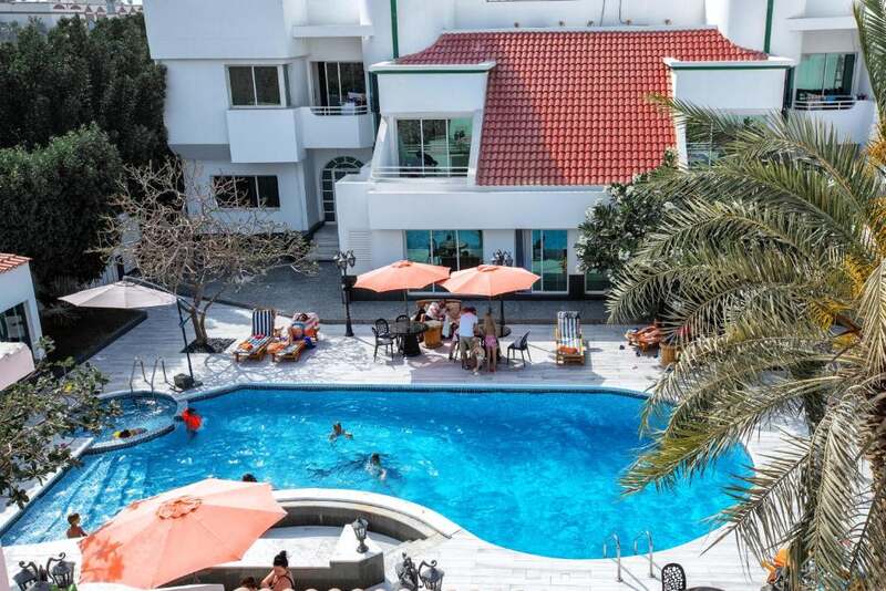 Outdoor swimming pool and sun terrace at Al Khalidiah Resort